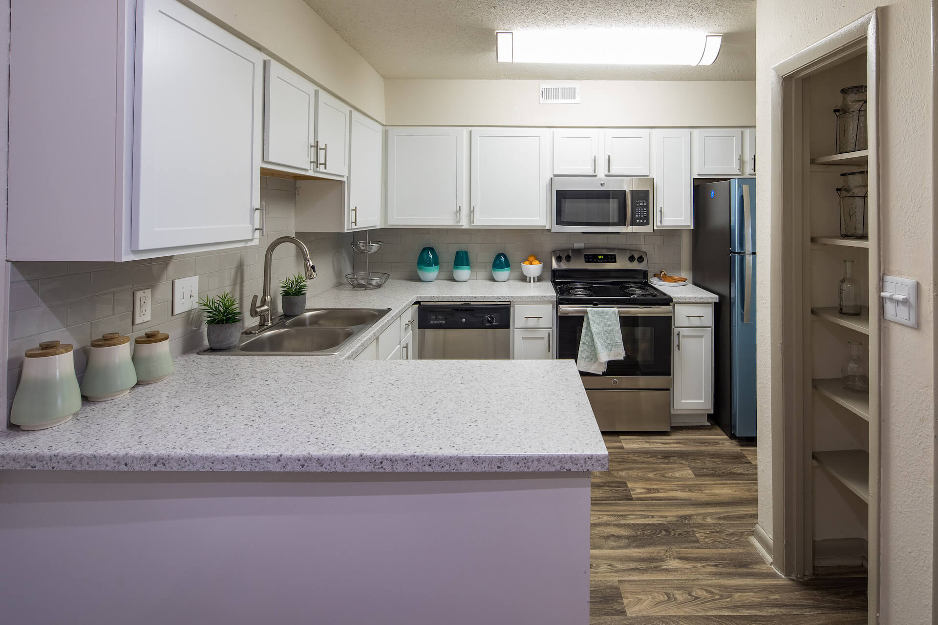 Kitchen with ample lighting and pantry