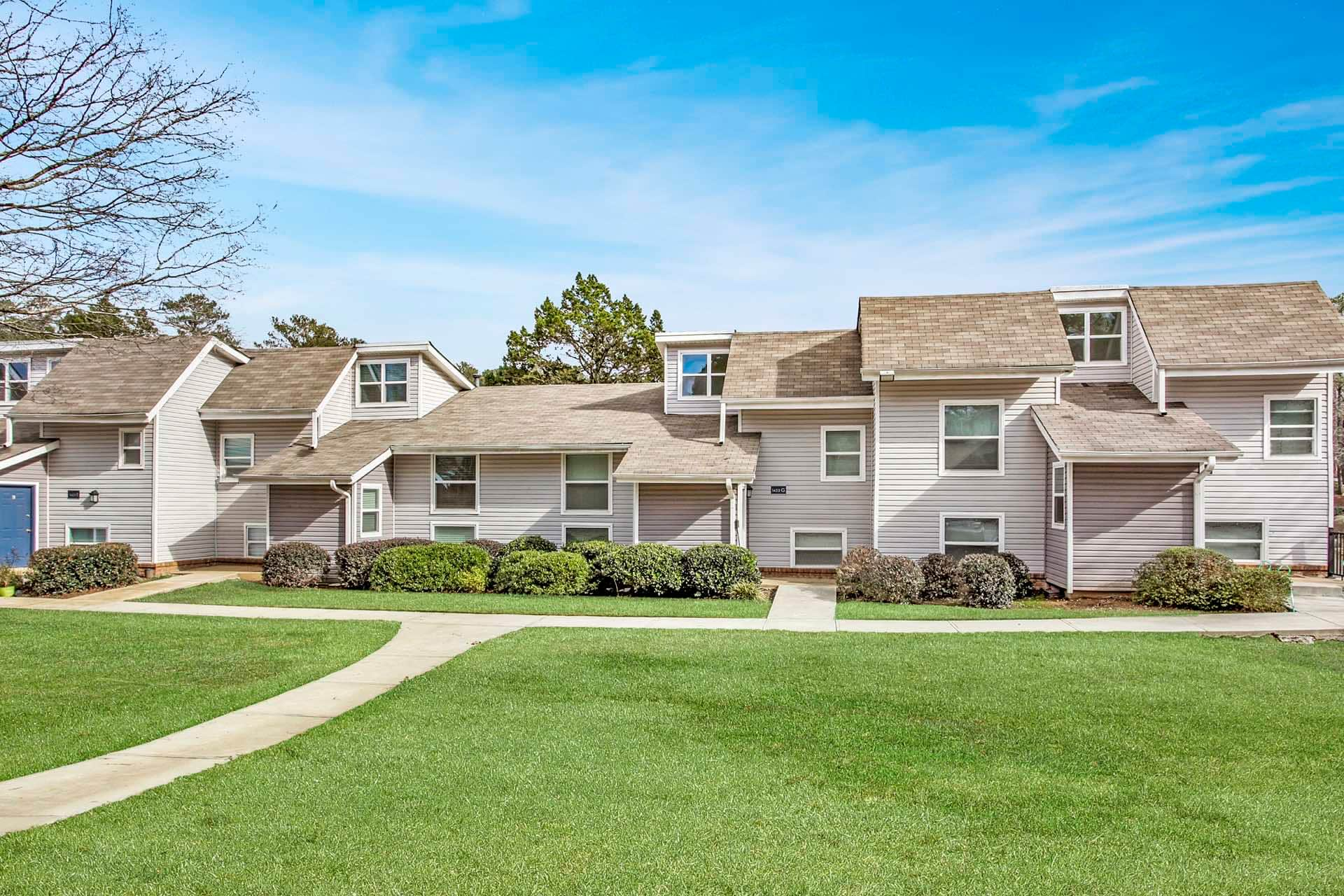 exterior view of apartment buildings with landscaping